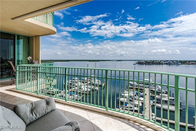 balcony featuring a water view