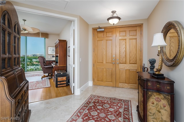 foyer entrance with light wood-type flooring