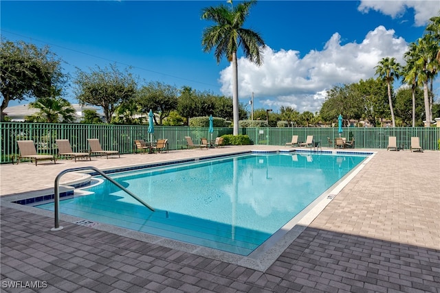 view of swimming pool with a patio area