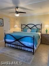 bedroom featuring ceiling fan, tile patterned floors, and crown molding