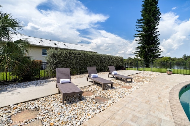 view of patio featuring a swimming pool