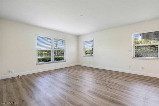 empty room with light hardwood / wood-style floors