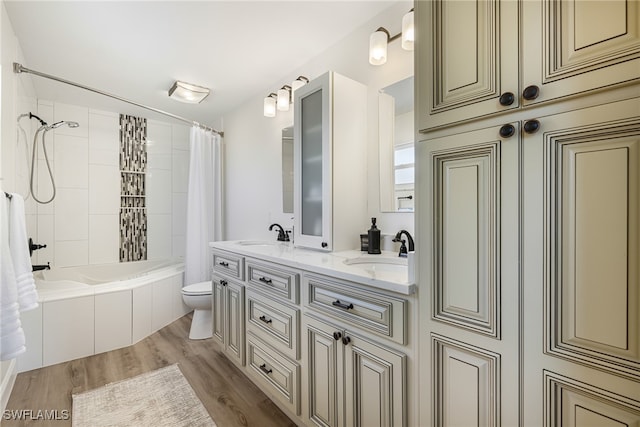 full bathroom featuring shower / bath combination with curtain, vanity, toilet, and hardwood / wood-style flooring