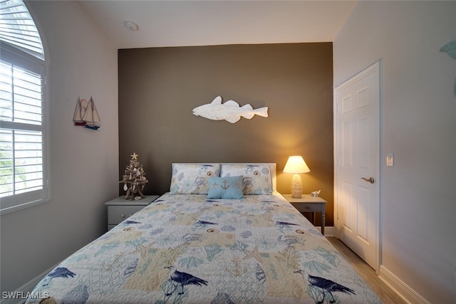 bedroom with light wood-type flooring