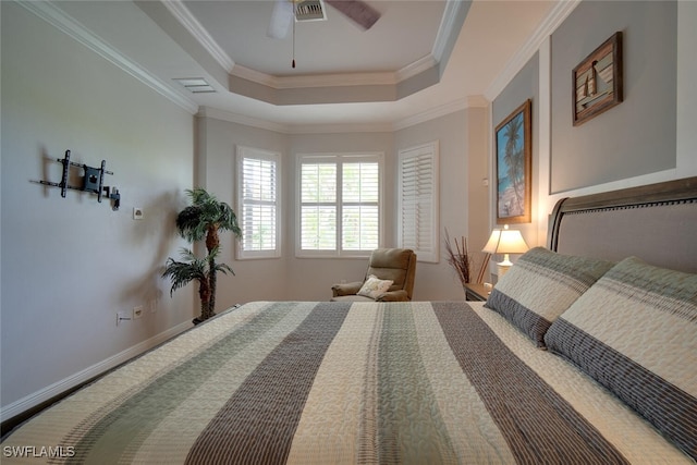 bedroom with a raised ceiling, ornamental molding, and ceiling fan