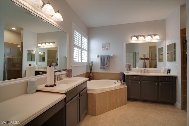 bathroom with vanity, tile patterned flooring, and separate shower and tub