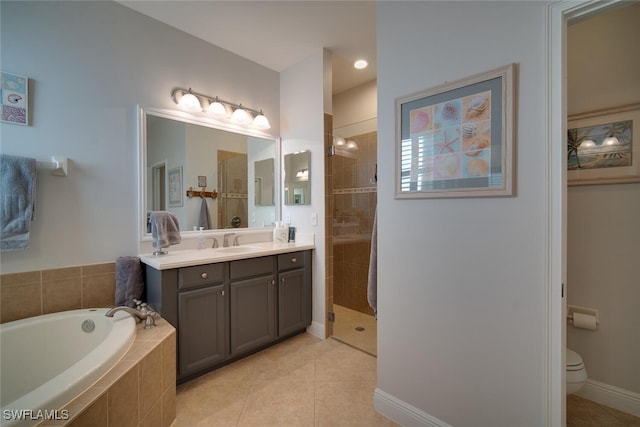 full bathroom featuring tile patterned flooring, toilet, vanity, and separate shower and tub