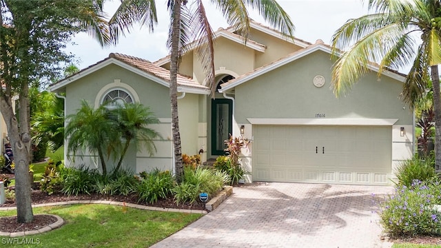 mediterranean / spanish-style home featuring a garage