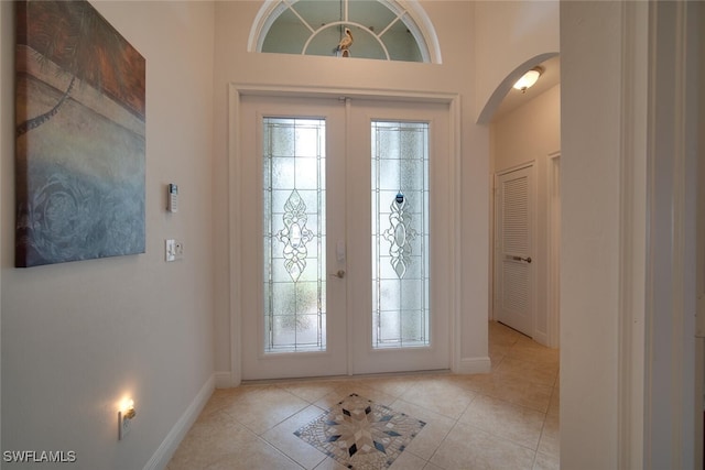 tiled foyer entrance with french doors