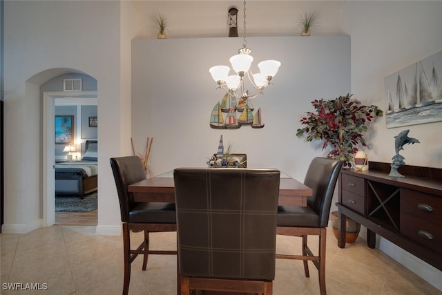 dining space featuring a chandelier and light tile patterned floors