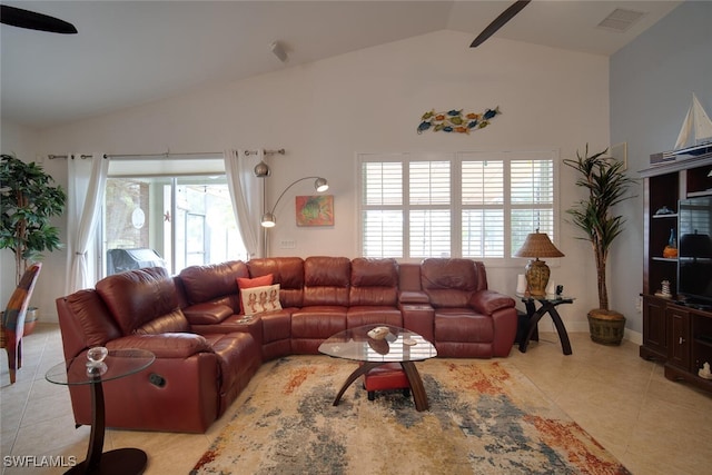 living room featuring light tile patterned floors, lofted ceiling, and ceiling fan