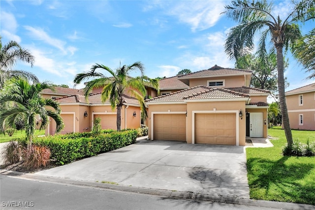 mediterranean / spanish house featuring a front lawn