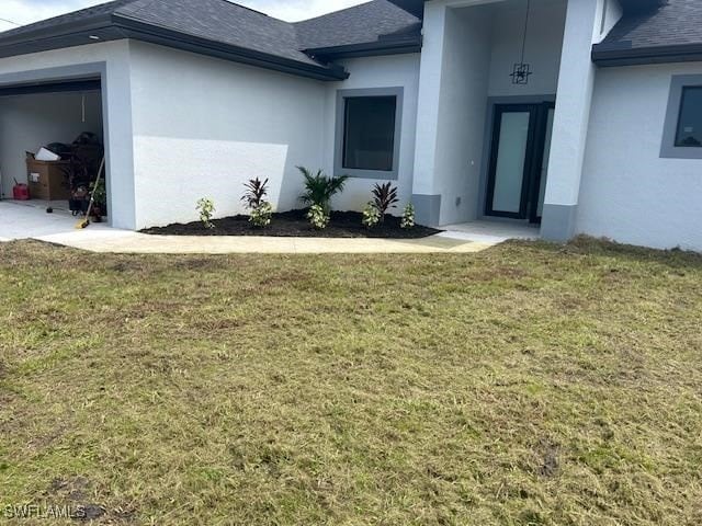 view of side of home featuring a lawn