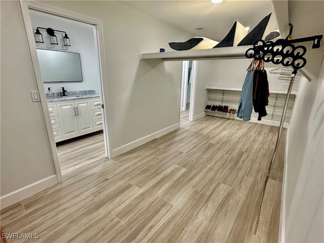 interior space with sink and light hardwood / wood-style flooring