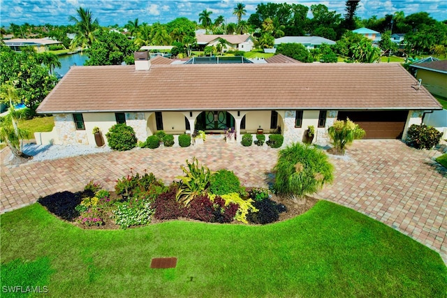 birds eye view of property with a water view