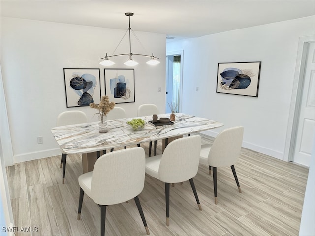 dining space featuring light hardwood / wood-style floors