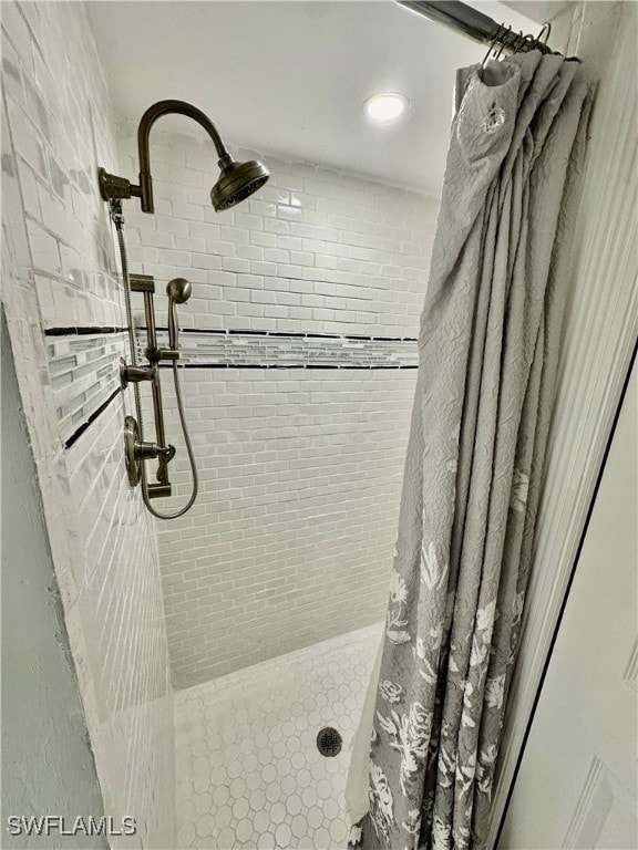 bathroom featuring curtained shower