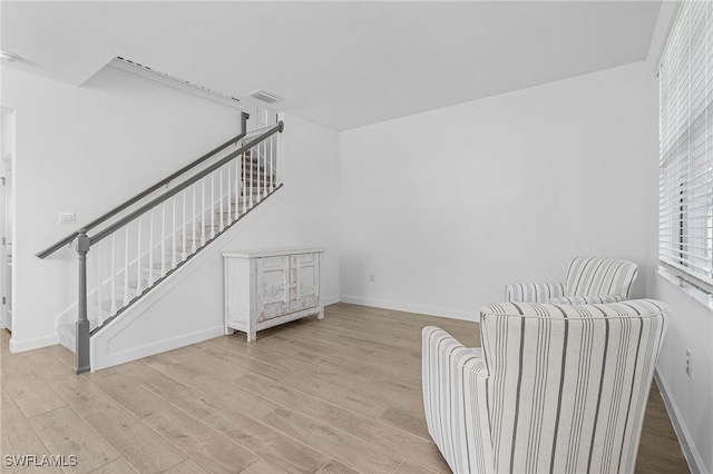 sitting room featuring light hardwood / wood-style flooring