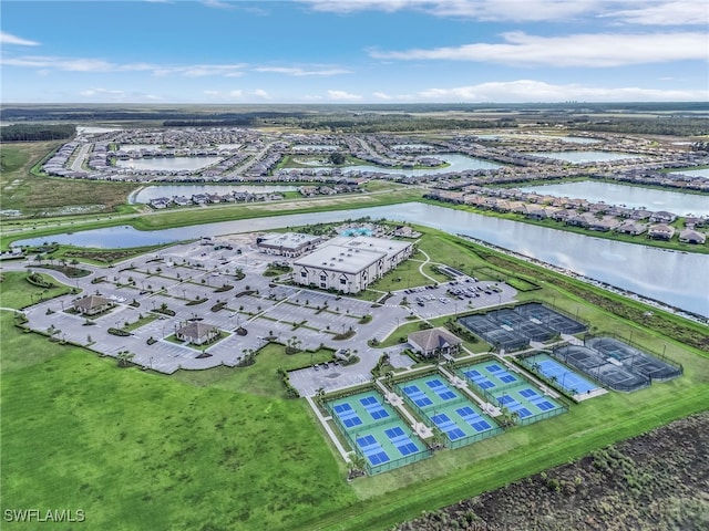 birds eye view of property with a water view