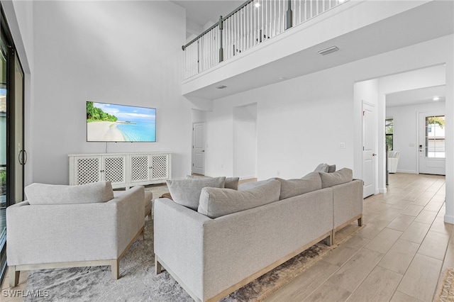 living room with a high ceiling