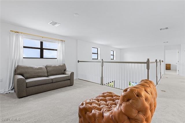 living room featuring light carpet