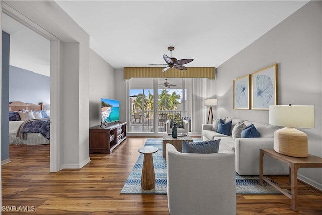 living room with hardwood / wood-style floors and ceiling fan