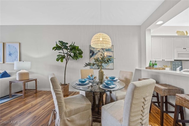 dining space featuring hardwood / wood-style floors