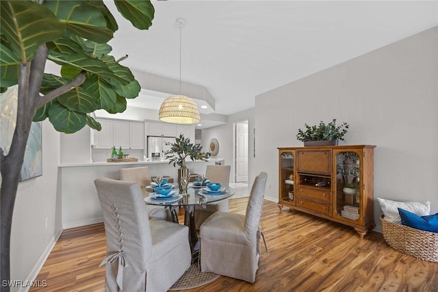 dining space with light wood-type flooring