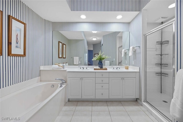 bathroom featuring vanity, tile patterned flooring, and shower with separate bathtub