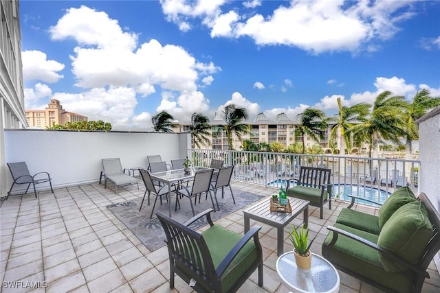 view of patio / terrace featuring a community pool