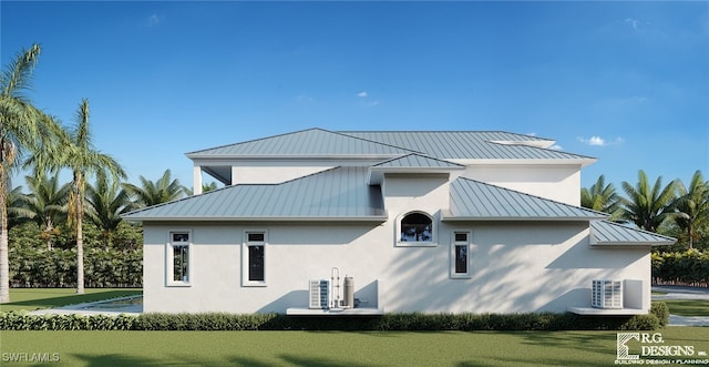 back of house featuring a lawn and central air condition unit