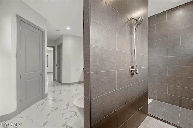 bathroom featuring tiled shower