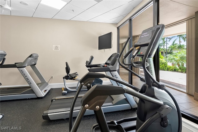 exercise room featuring a paneled ceiling