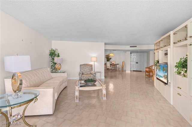 living room featuring a textured ceiling