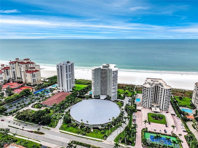 birds eye view of property with a view of the beach and a water view