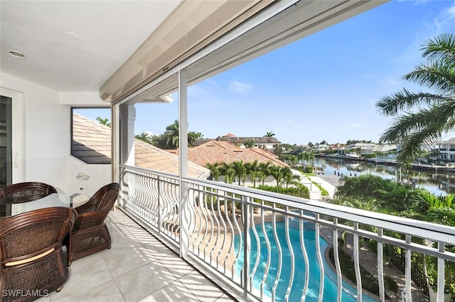 balcony featuring a water view