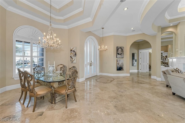 255 Mermaids Bight, Naples, FL 34103 - dining room featuring baseboards, a high ceiling, arched walkways, ornamental molding, and a notable chandelier