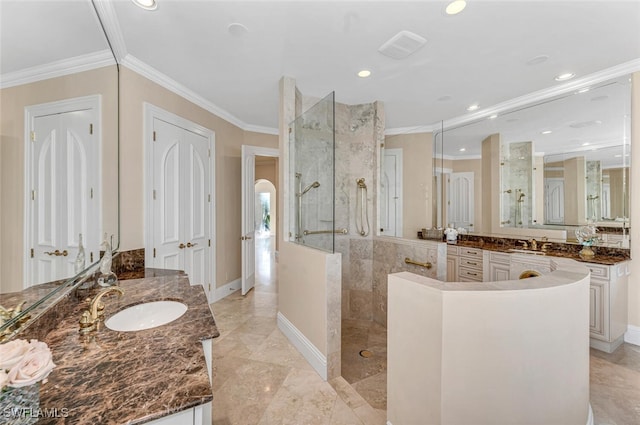 bathroom featuring a shower, vanity, and crown molding