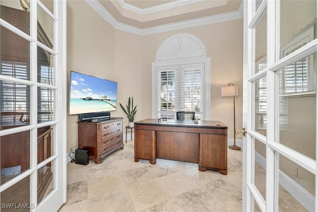 office area with ornamental molding and a towering ceiling