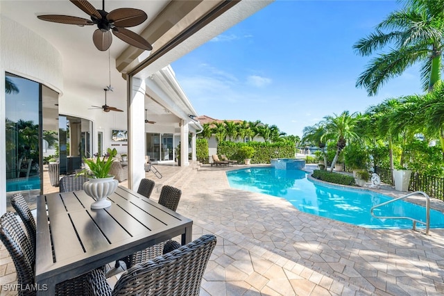 255 Mermaids Bight, Naples, FL 34103 - view of swimming pool with outdoor dining space, a ceiling fan, fence, a pool with connected hot tub, and a patio area