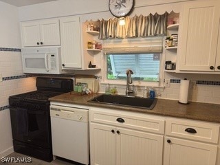 kitchen with white cabinets, sink, white appliances, and decorative backsplash