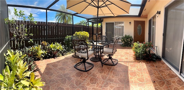 view of patio with a lanai