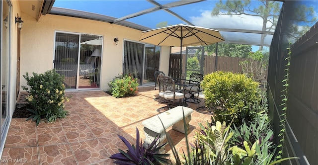 view of patio with a lanai