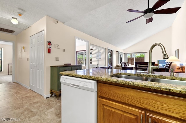 kitchen with dishwasher, a textured ceiling, lofted ceiling, ceiling fan, and sink