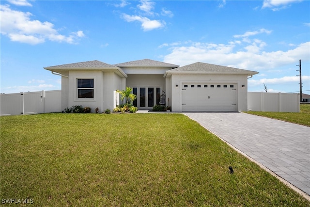 view of front of home featuring a garage and a front yard