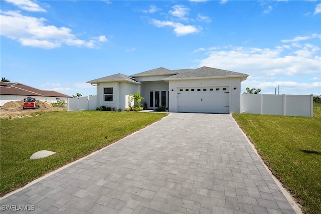 view of front facade featuring a garage and a front lawn