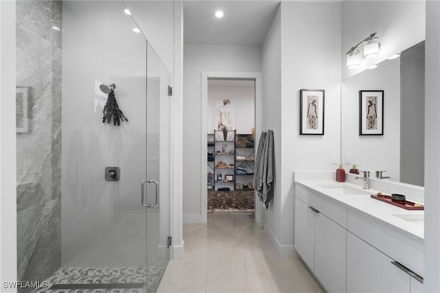 bathroom featuring walk in shower and vanity