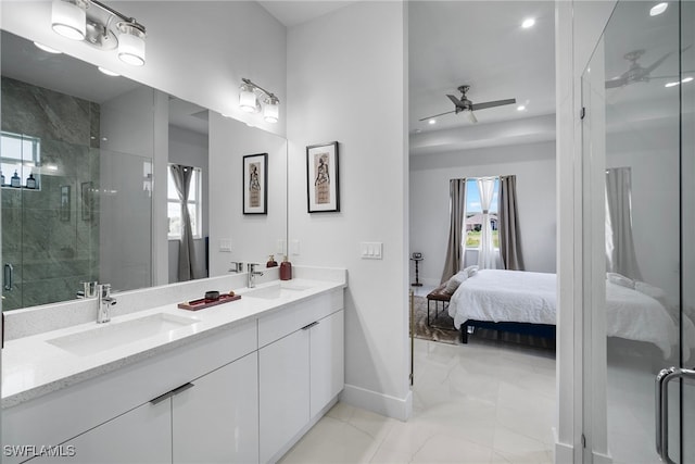 bathroom featuring ceiling fan, vanity, and a shower with door