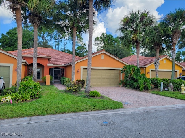 ranch-style house with a front yard and a garage