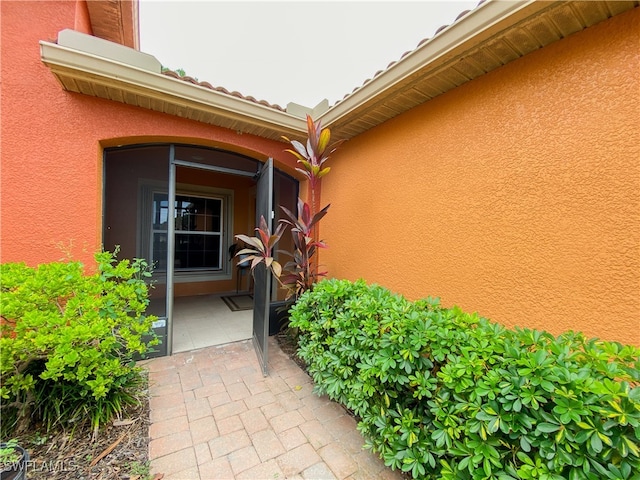 entrance to property with a patio area